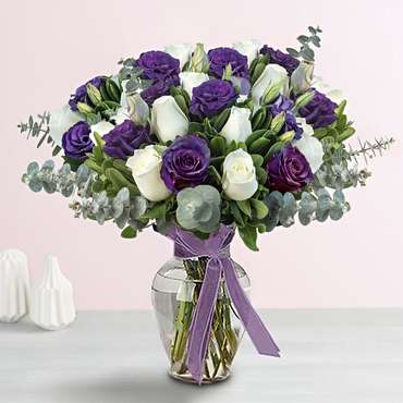 Vase of Purple and White Roses